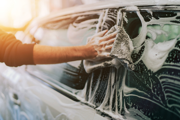 man-hand-washing-car